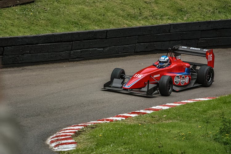 Red Racing Car On Race Track