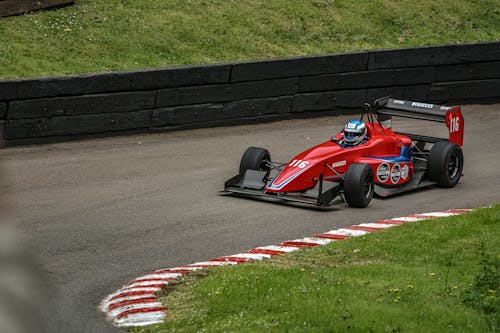Free Red Racing Car on Race Track Stock Photo