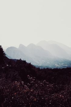 Foggy morning landscape of misty mountains in Burrel, Albania.