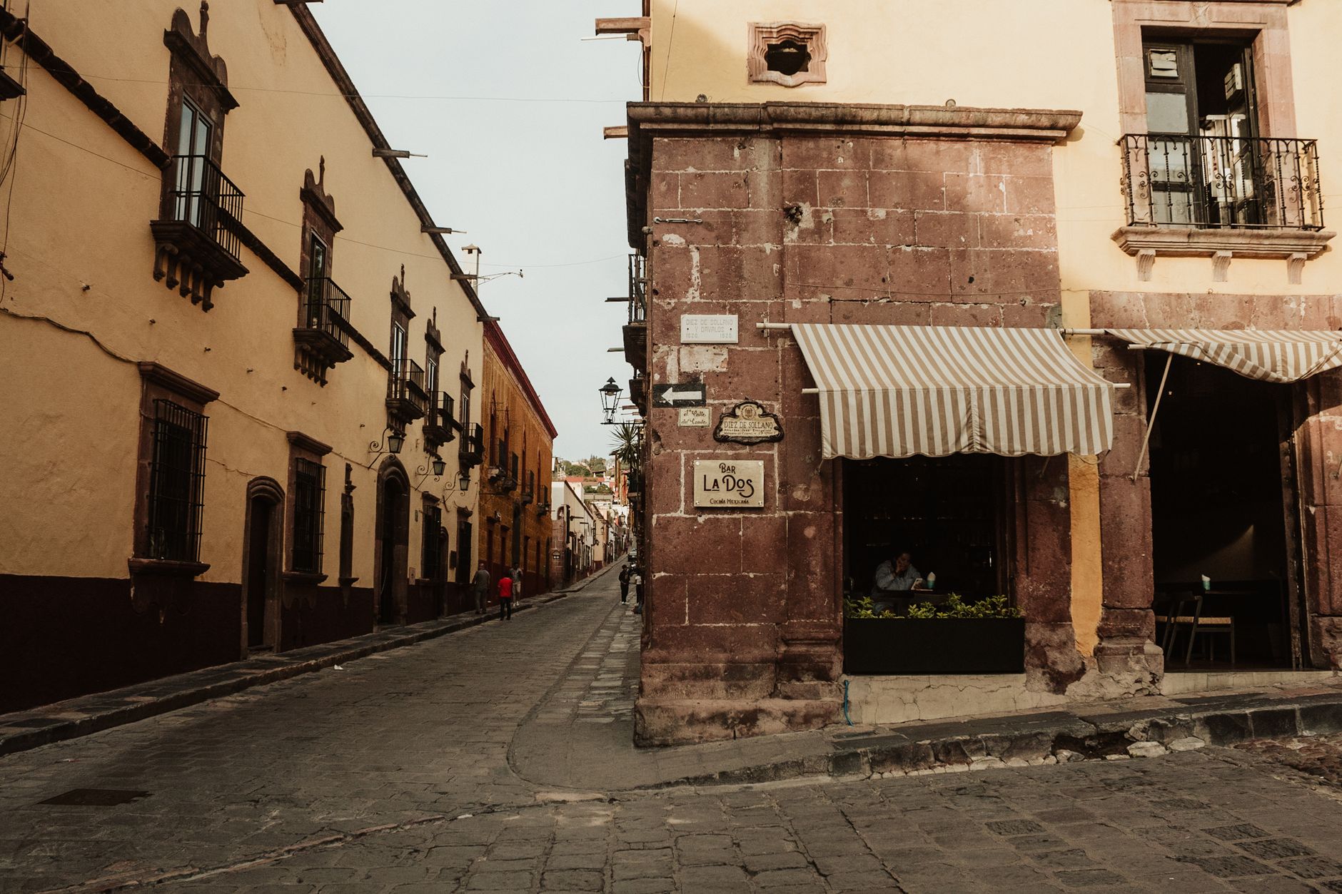Explore the charming streets of San Miguel de Allende with historic architecture and warm tones.