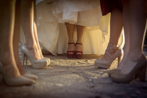 Free Legs of Women in Dresses and Hugh Heels Stock Photo