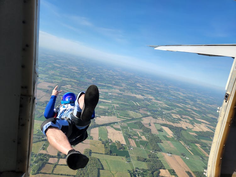 Man Jumping Off Plane