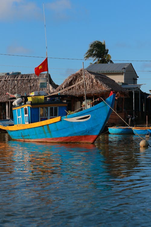 Motorboat Moored in Village