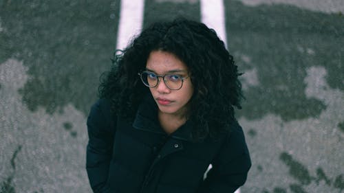 Woman in Jacket and with Eyeglasses