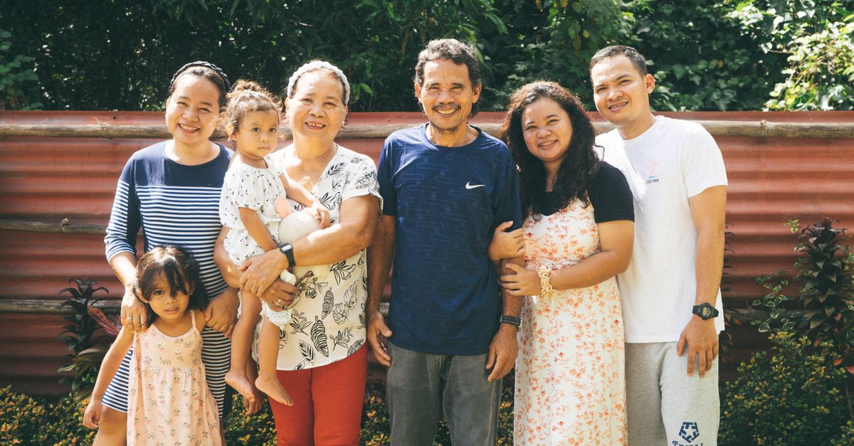 Joyful family enjoying outdoor time together in the garden.
