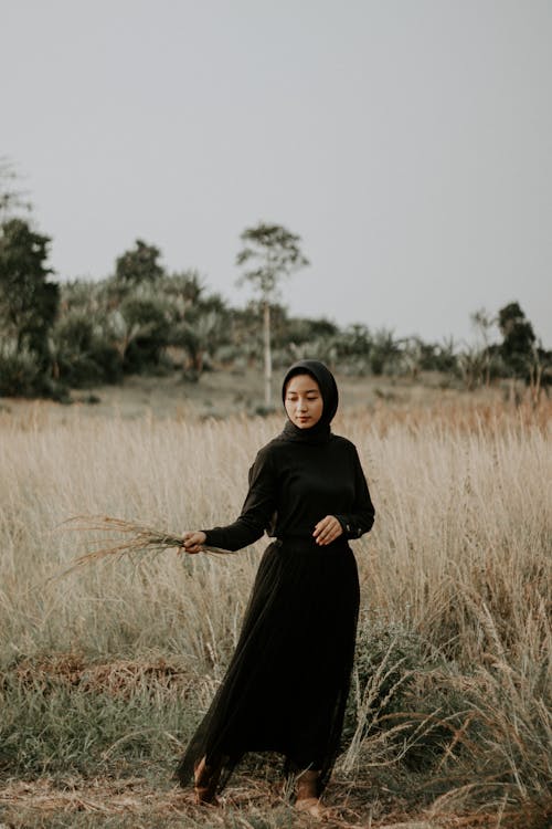 Woman Wearing Black Dress in Countryside