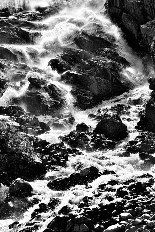Free Monochrome image capturing the powerful flow of a rocky waterfall. Stock Photo