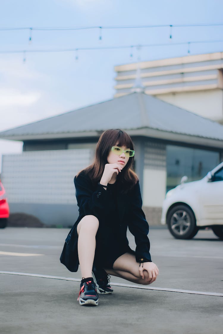 Woman Wearing Black Clothes And Sneakers