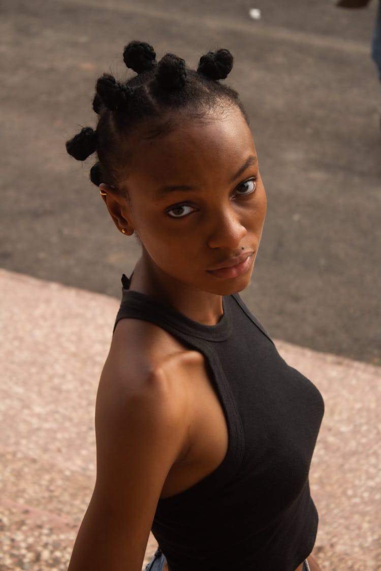 Close Up Photo Of Woman In Black Sleeveless Top