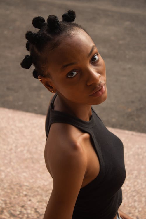 Close Up Photo of Woman in Black Tank Top