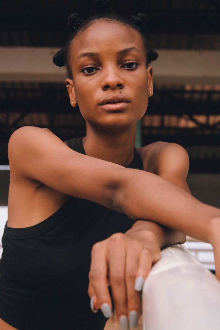 A Woman In Black Sleeveless Top