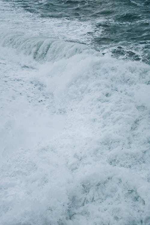 Free Foam on the Crashing Sea Waves Stock Photo