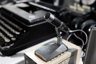 Close Up of Vintage Microphone and Typewriter