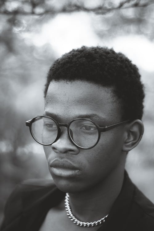 Black and White Photo of Man Wearing Eyeglasses