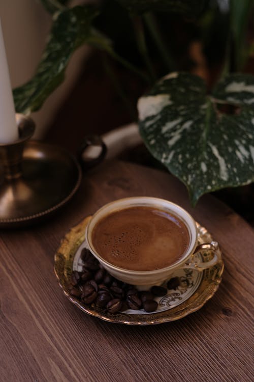 Free Cup of Coffee Beside Coffee Beans Stock Photo