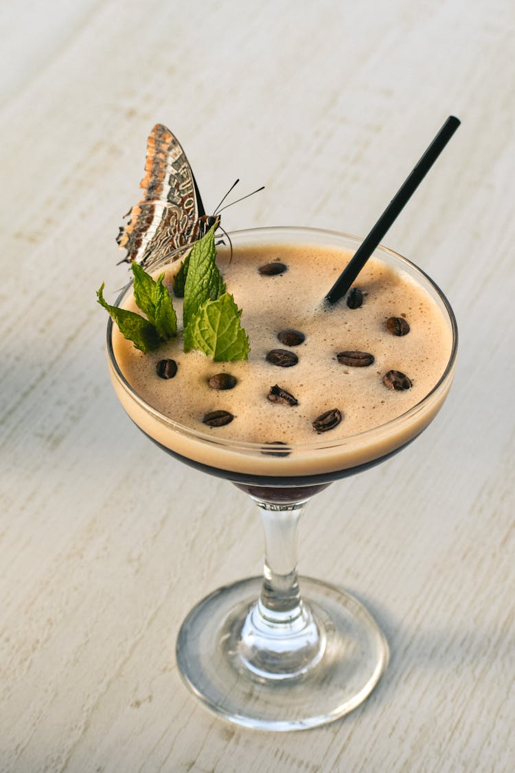 Butterfly Perched On Espresso Martini Cocktail