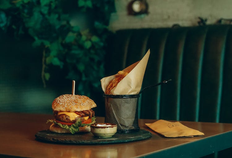 Burger And Fries On Table