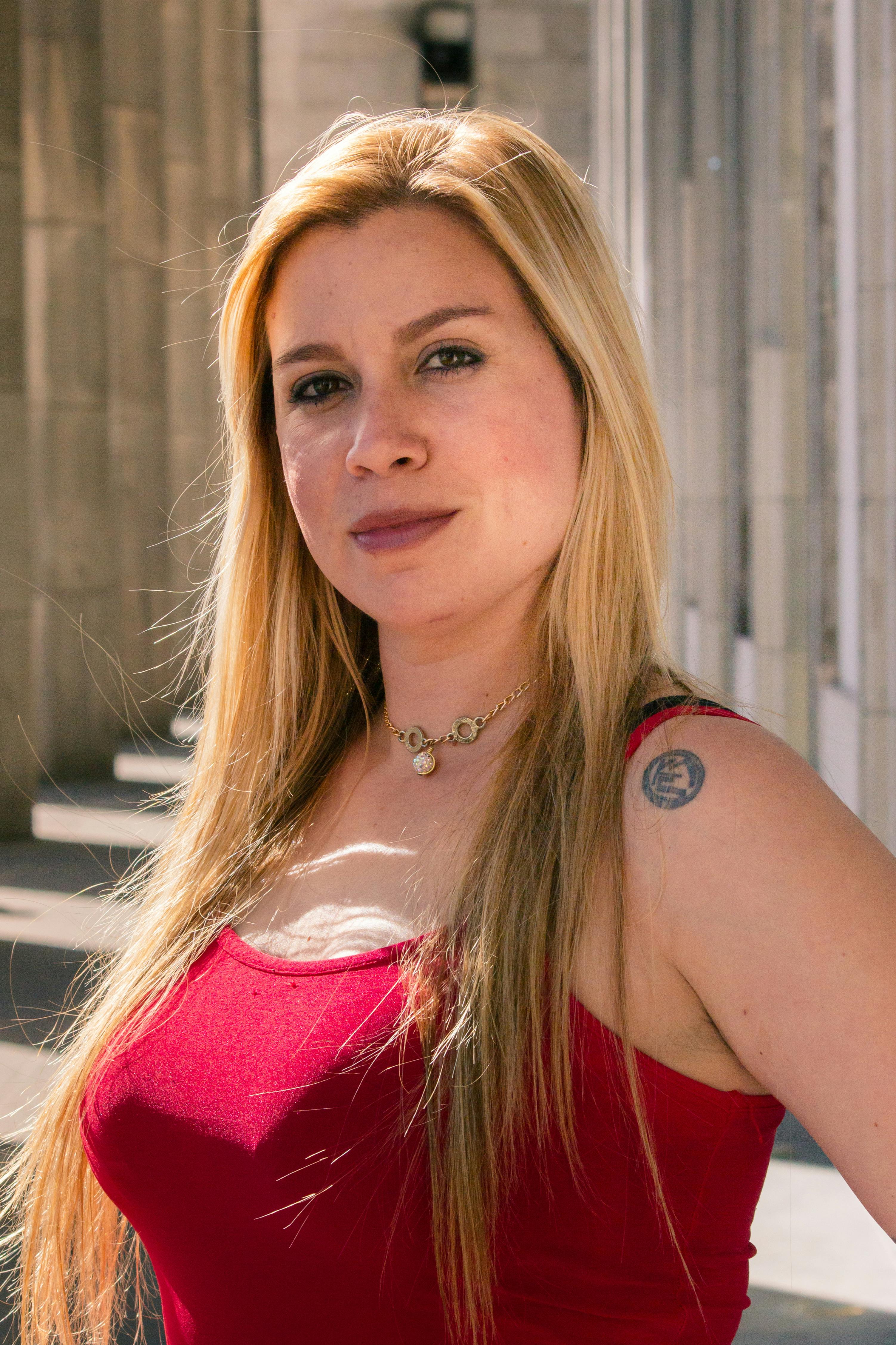 Close-up portrait of a woman in Buenos Aires during daytime showcasing confidence.