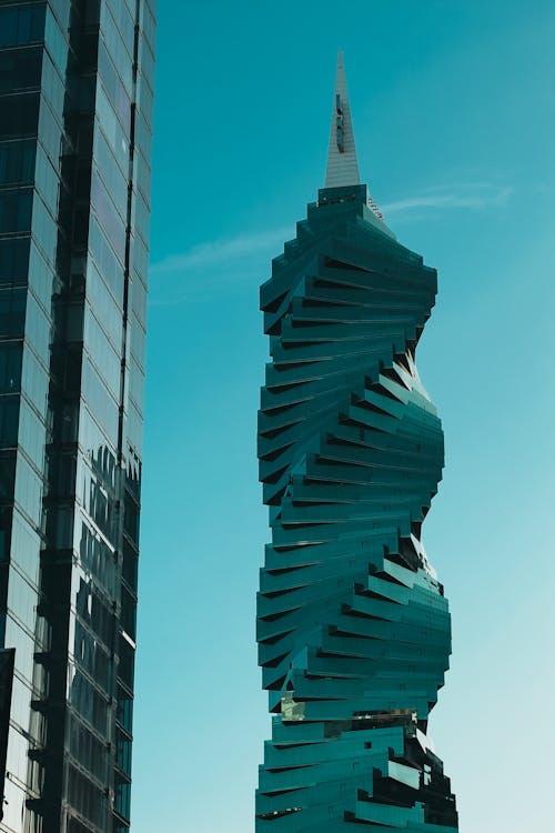 Modern Futuristic Glass Skyscraper on Blue Sky