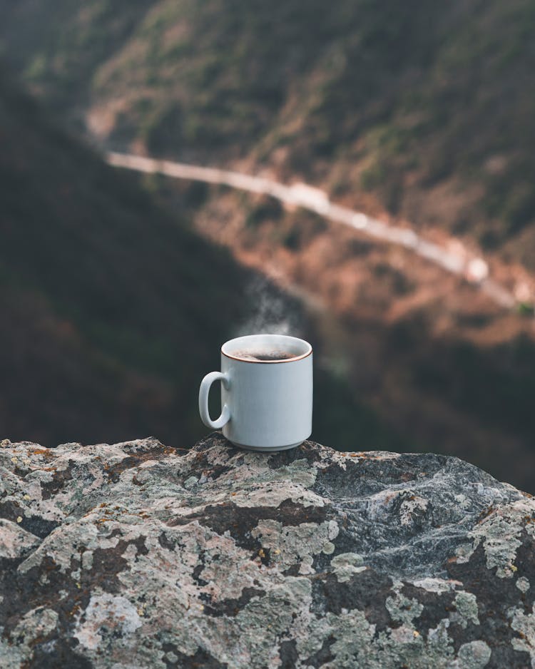 Coffee In Mug On Rock