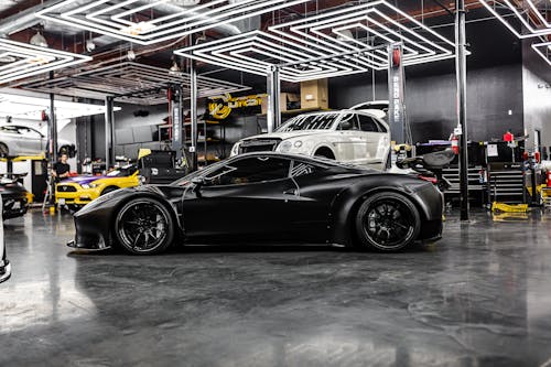 Black Sports Car in an Auto Repair Shop 