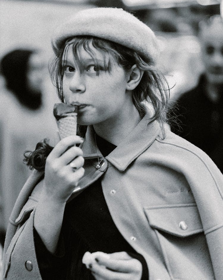 Woman Eating Ice Cream In Black And White