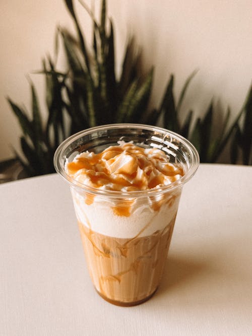 Free Coffee with Cream in a Plastic Cup  Stock Photo