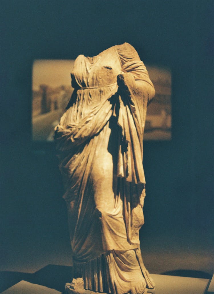 A Headless Statue In A Museum 