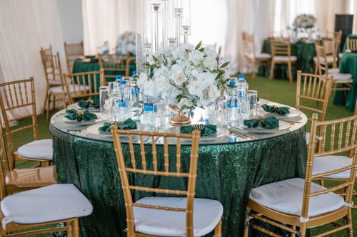 Free A beautifully decorated wedding reception table with white flowers and elegant tableware. Stock Photo