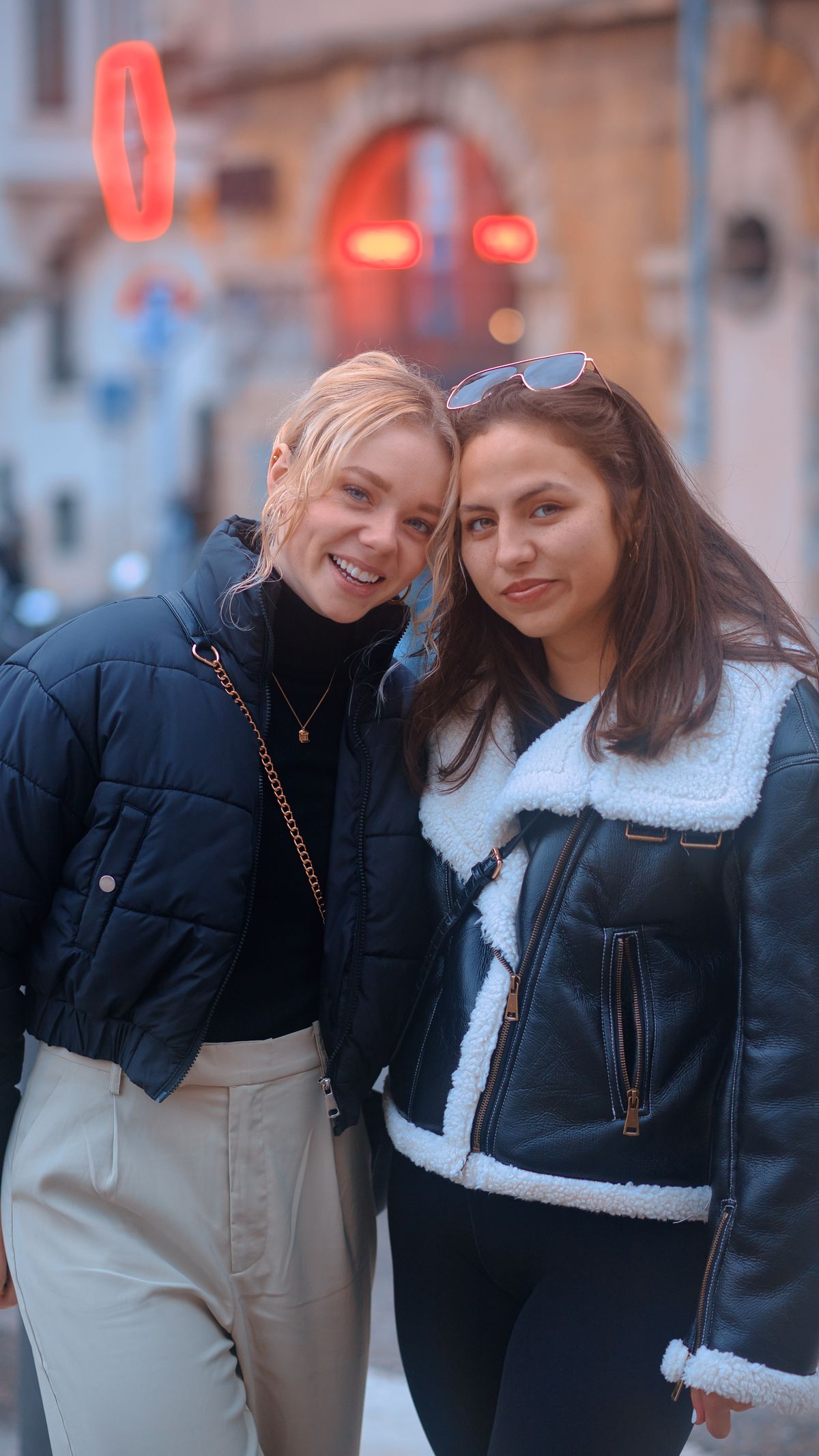 Story frame: two friends smiling together on a city street. Photo by Omran Soliman on Pexels