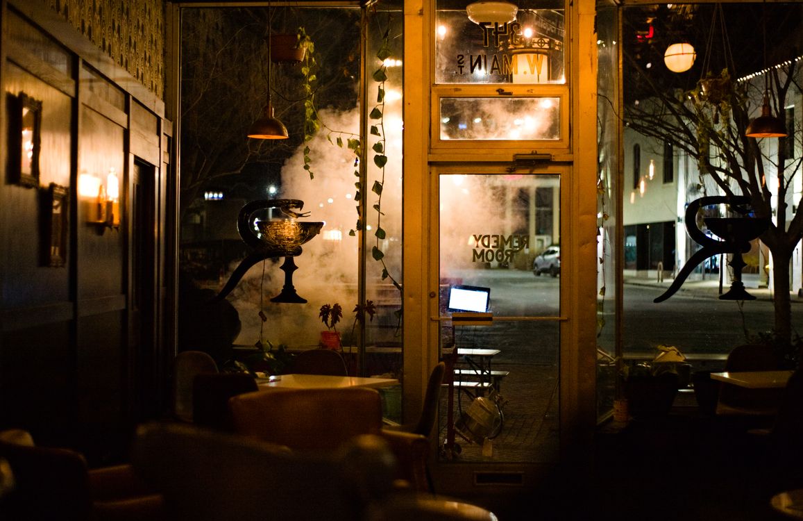 Empty Cafwe Interior of an Empty Cafe in City at Night · Free Stock Photo