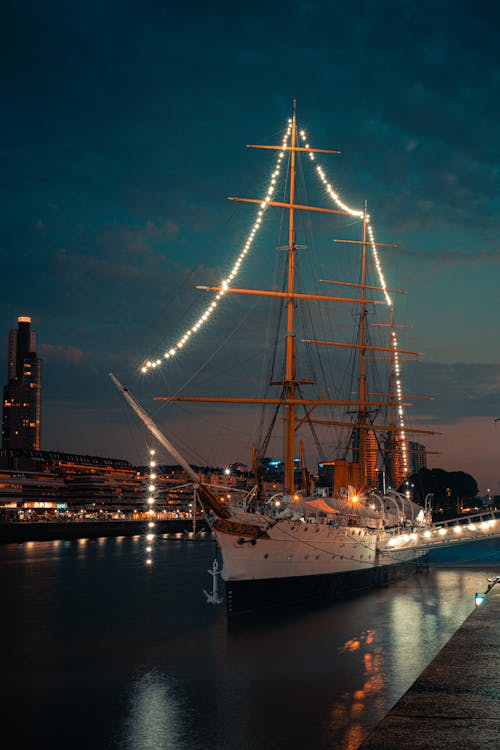 Illuminated Ship in Urban Area