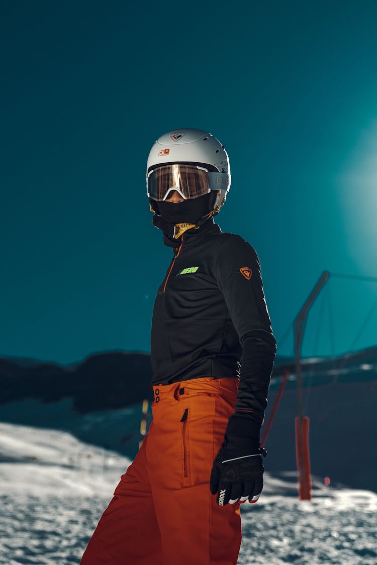 Man In Skiing Attire In Mountains 