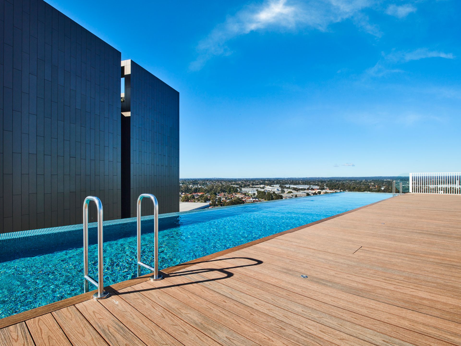 Stunning rooftop infinity pool with city skyline view in New York. Perfect summer oasis.