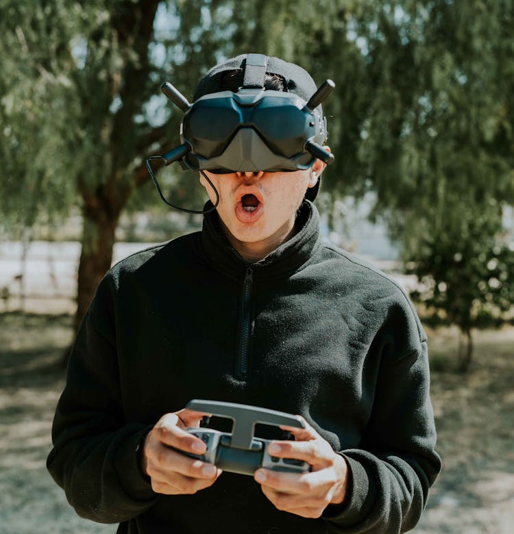 Man Playing With VR Goggles And Controller