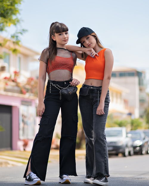 Free Girls in Matching Clothes Posing to Photo Stock Photo