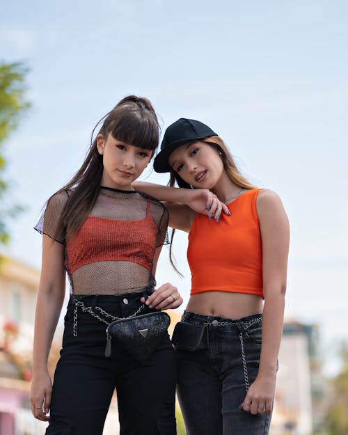 Free Girls in Matching Clothes Posing to Photo Stock Photo