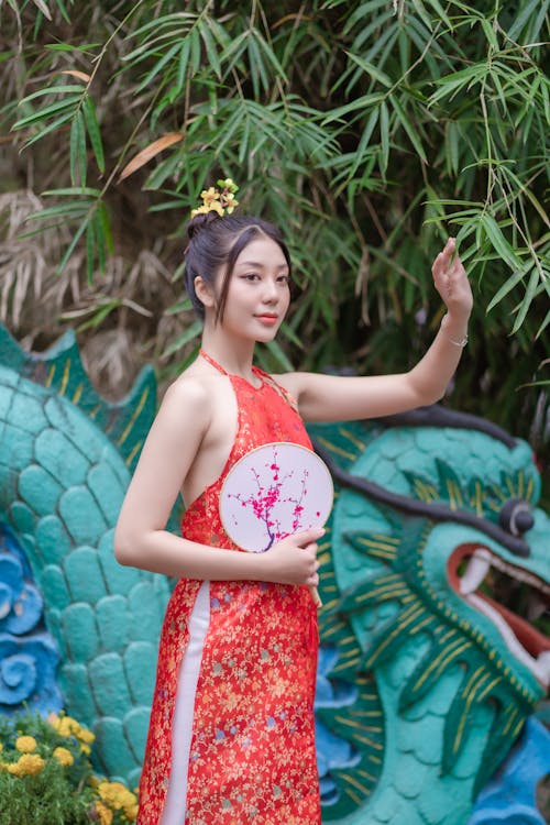 Woman with Fan against Chinese Dragon Figure