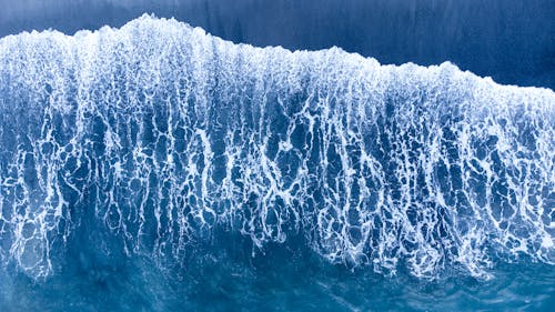 Top View Photo of Seawaves on Shore