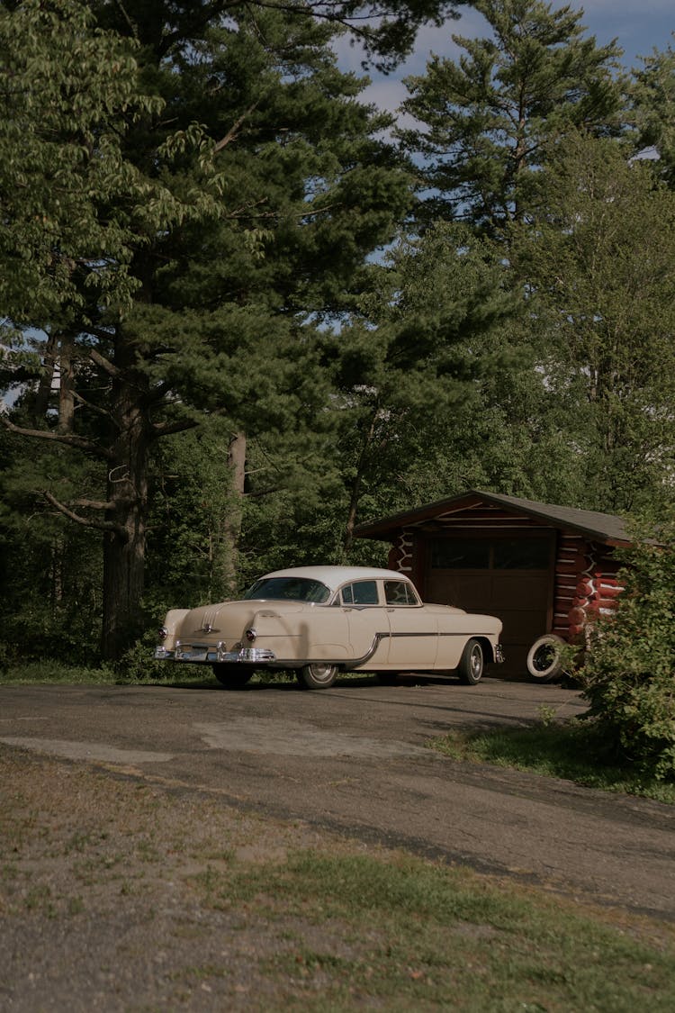 Vintage Car Parked By A Garage