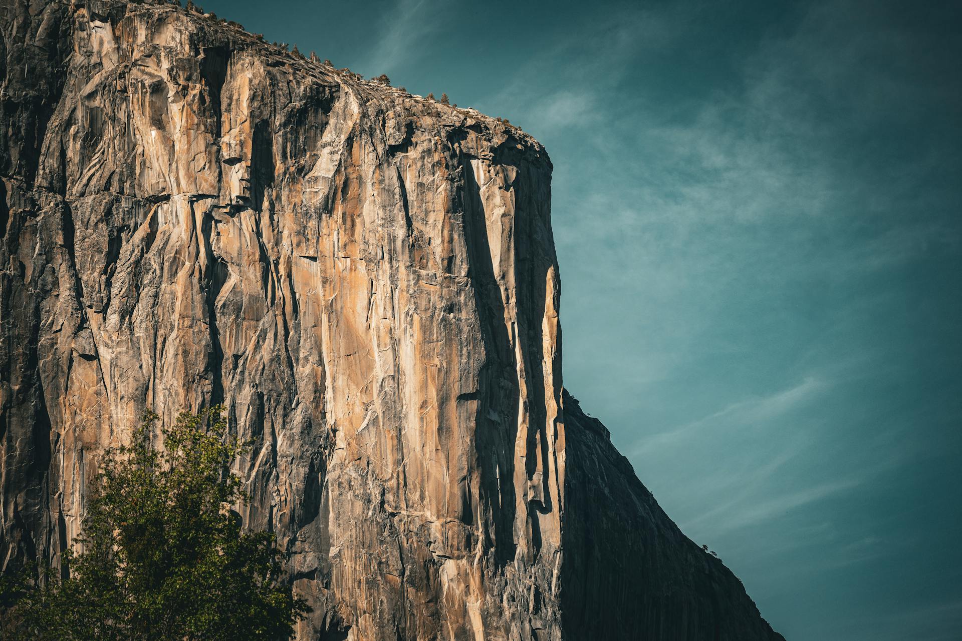 Majestic view of El Capitan rock face in Yosemite National Park under clear sky.