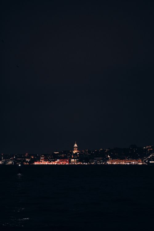 Free A stunning view of the city skyline at night featuring the iconic Galata Tower. Stock Photo