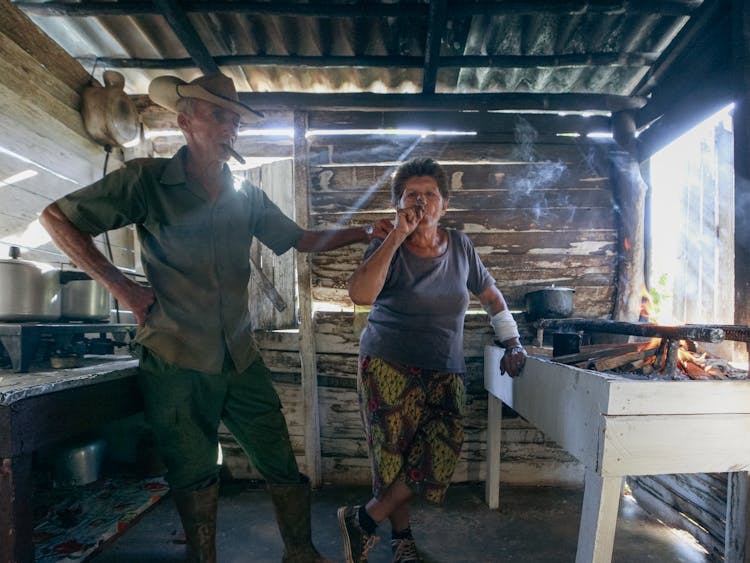 Man And Woman Smoking Cigars