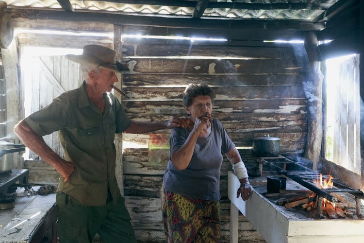 Woman And Man Smoking Cigars