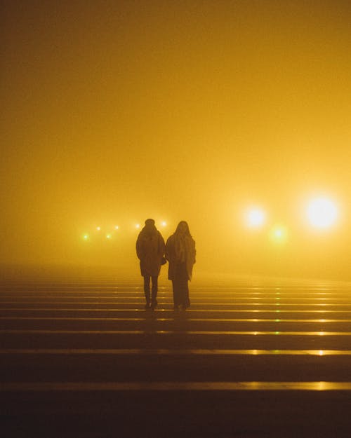 People Walking in Fog