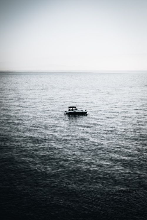 Free A lone boat navigates the vast, serene waters near Adalar, İstanbul, Türkiye. Stock Photo