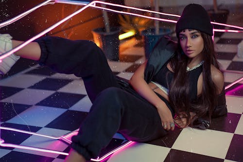 Woman in Hat Lying Down on Floor