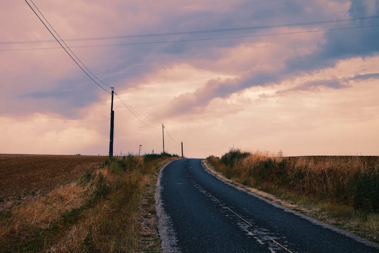 Road In The Middle Of A Grass Field