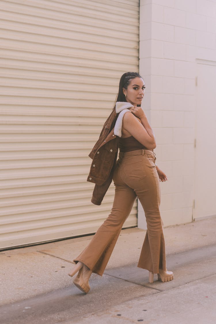 Stylish Woman Walking On City Street