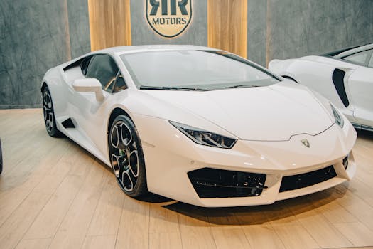 A stunning white Lamborghini sports car displayed in a high-end automobile showroom.